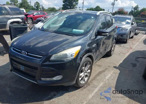2014 Ford Escape Titanium z USA, uszkodzony, nr VIN 1FMCU0J97EUB49449